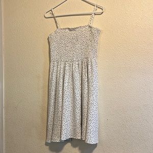 This is a white polkadot dress. In a woman’s size medium.